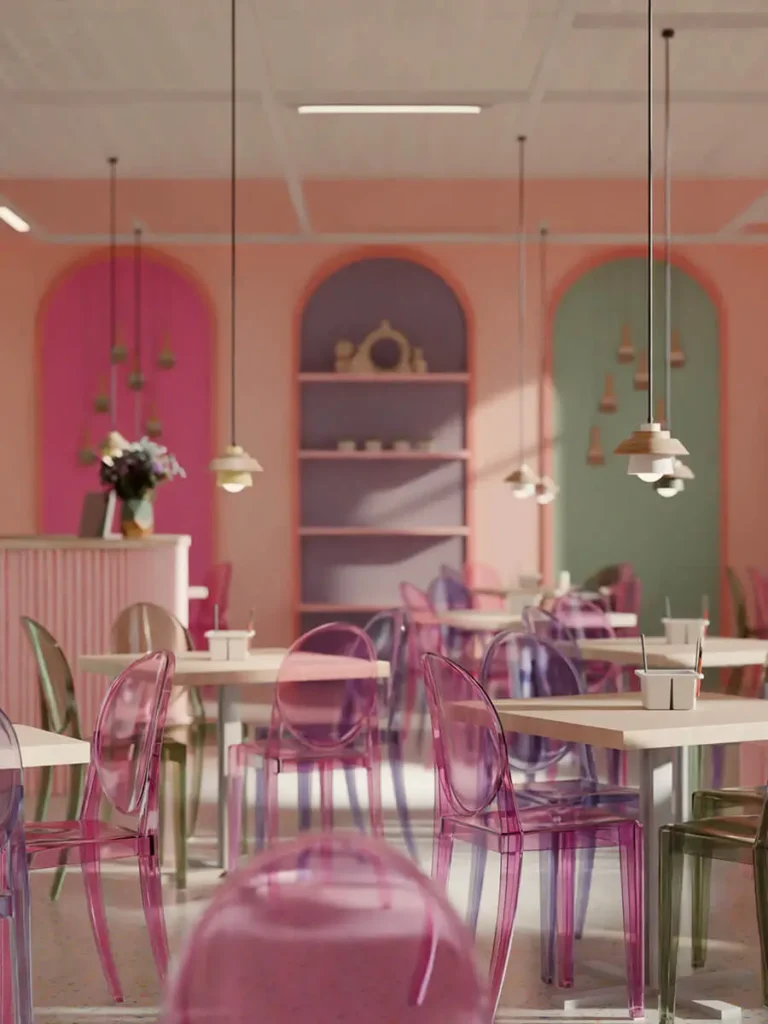Kolorowe wnętrze restauracji w Łodzi z pastelowymi ścianami w odcieniach różu i zieleni oraz przezroczystymi krzesłami – komercyjny projekt wnętrza.