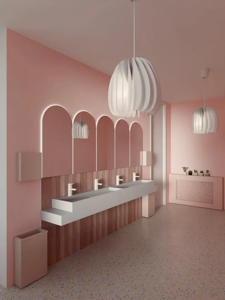 Pełny widok sali jadalnej w komercyjnym projekcie restauracji w Łodzi – pastelowe kolory, łukowe wnęki i designerskie oświetlenie.